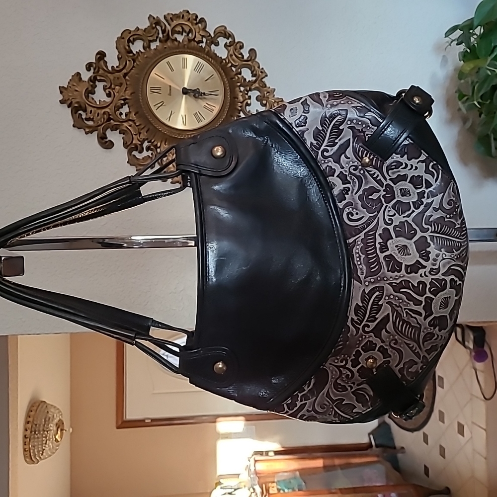 Tooled leather bags.  1 for You and 1 for Mini you (your daughter).